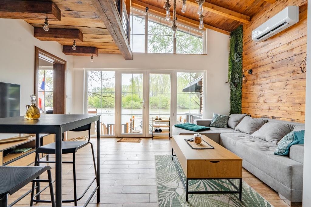 a living room with a couch and a table at Bear Secret House in Ćuprija