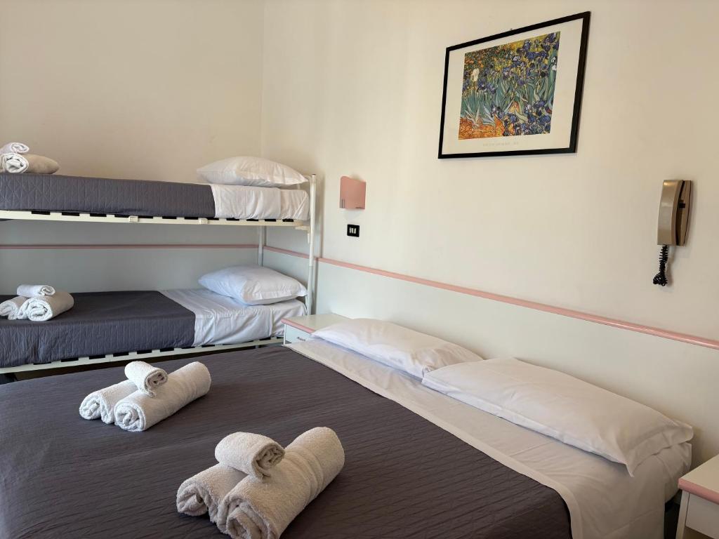 Postel nebo postele na pokoji v ubytování Hotel Rosy