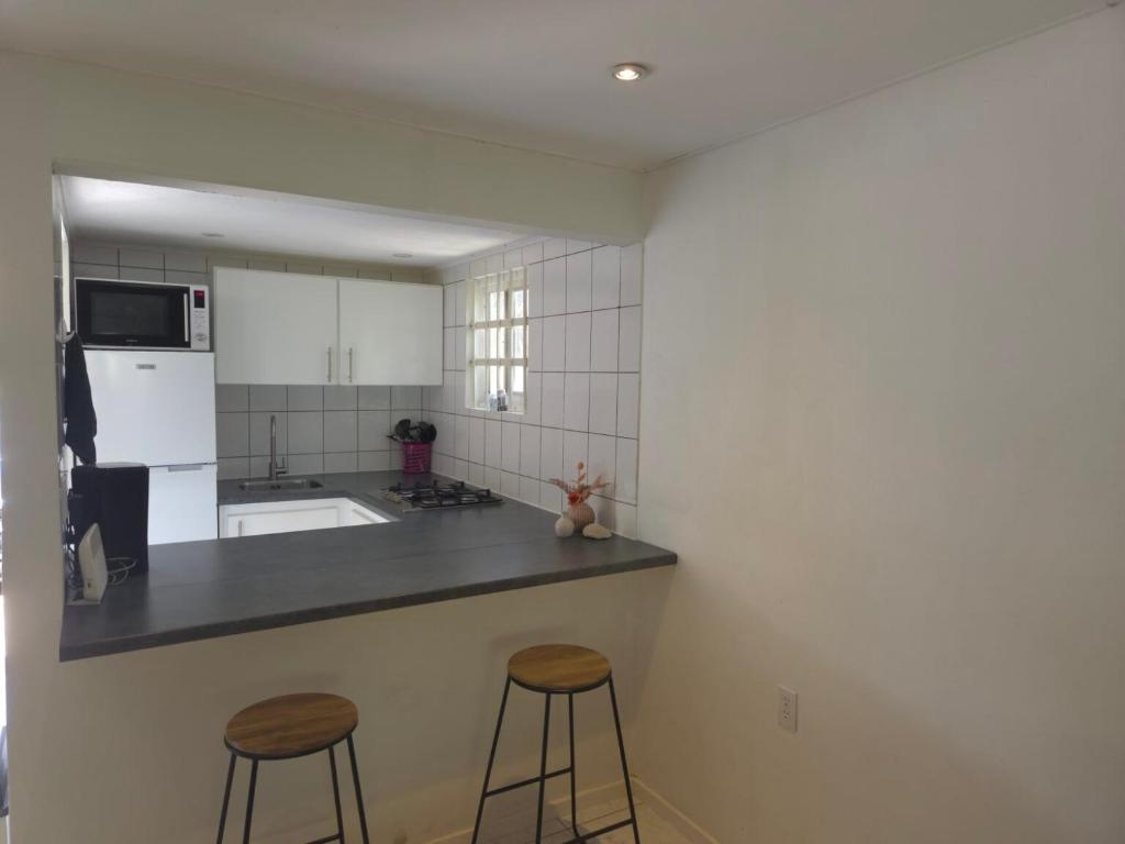 Kuchyň nebo kuchyňský kout v ubytování Seru Coral Apartment
