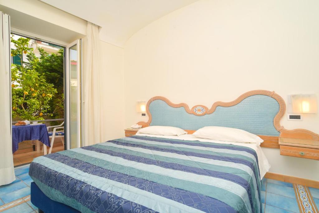 Cama o camas de una habitación en Albergo Italia - Beach Hotel