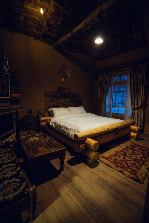 a bedroom with a bed in a room with a window at Azure Lagoon Resort 