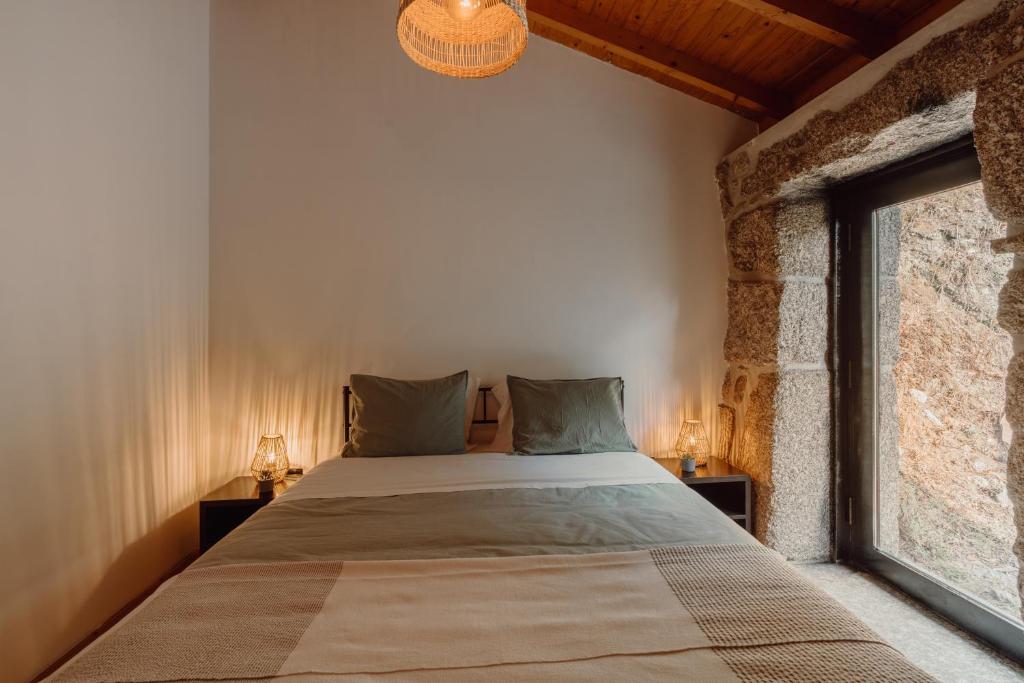Cama ou camas em um quarto em Aldeia Do Pontido