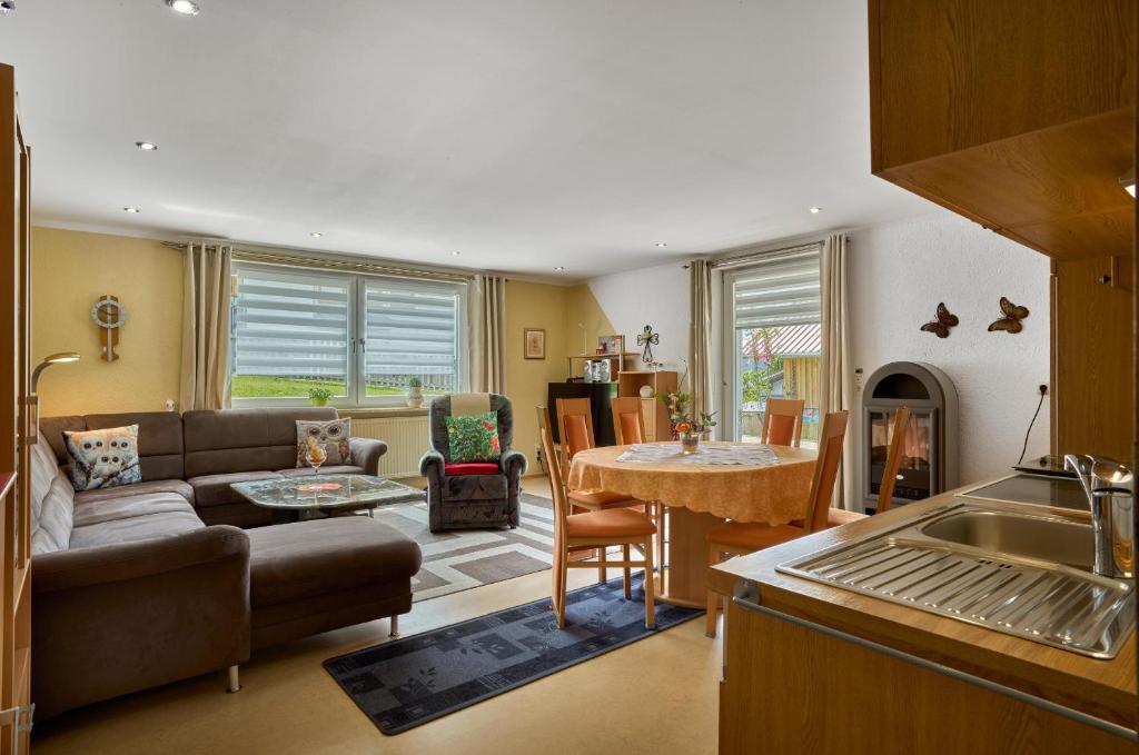 a living room with a couch and a table at Ferienwohnung Christa in Mauth