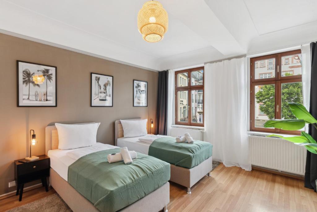 Ein Bett oder Betten in einem Zimmer der Unterkunft KERA STAY - Apartments Merseburg