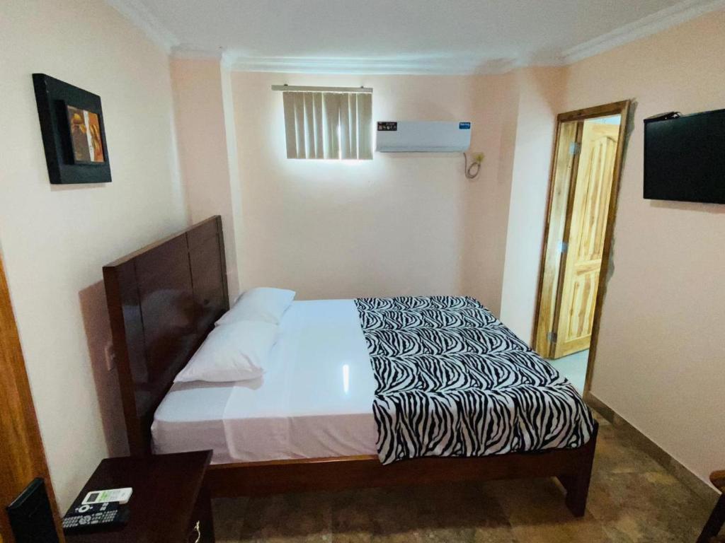Postel nebo postele na pokoji v ubytování HOTEL MARLUZ