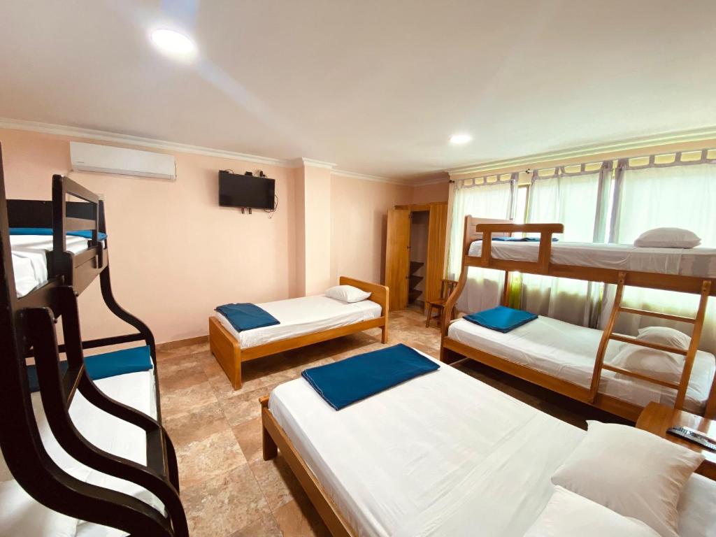 Postel nebo postele na pokoji v ubytování HOTEL MARLUZ
