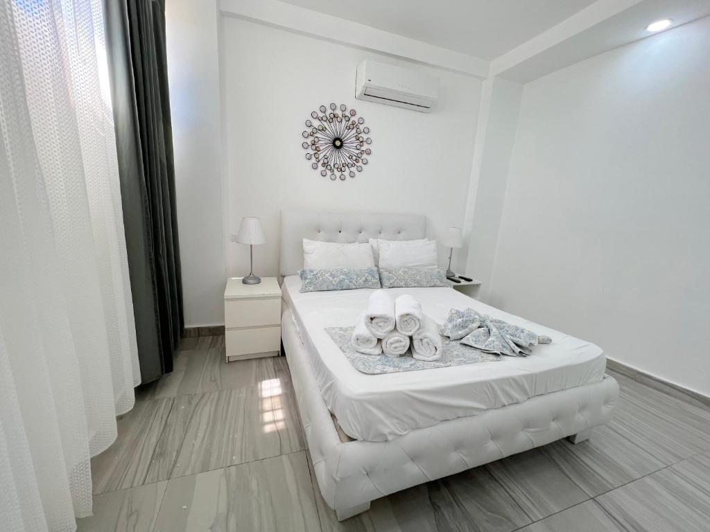 Krevet ili kreveti u jedinici u okviru objekta OLAS DEL CARIBE - VACATION SUITES with ROOFTOP POOL - PLAYA LOS CORALES