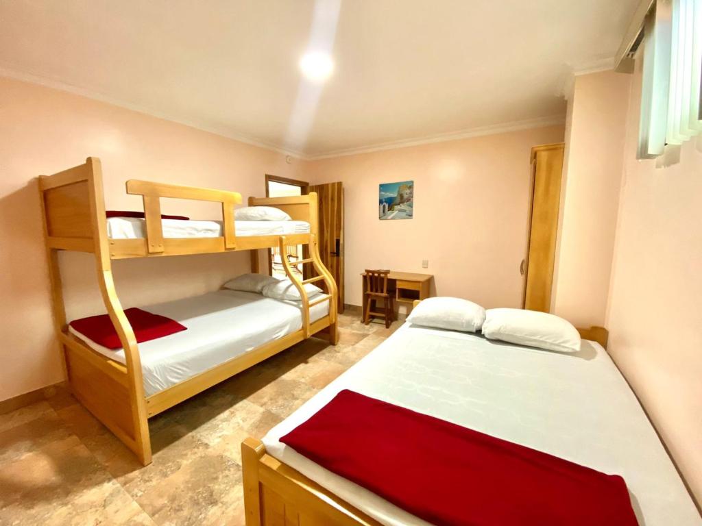 Postel nebo postele na pokoji v ubytování HOTEL MARLUZ