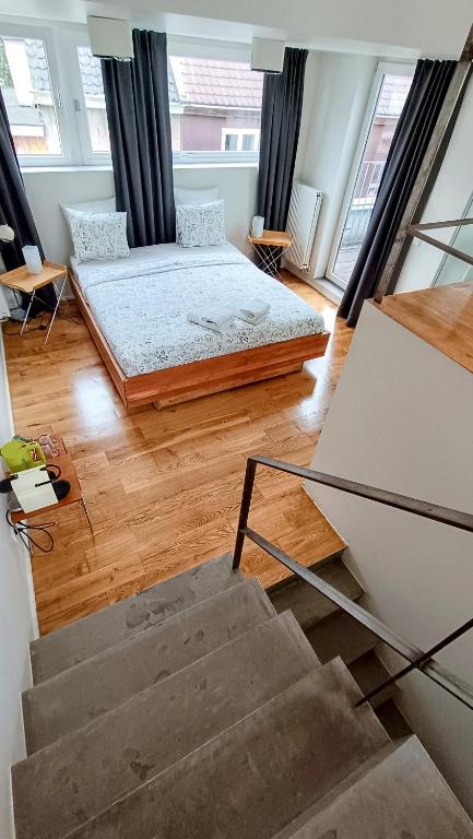Postel nebo postele na pokoji v ubytování Loftsuite