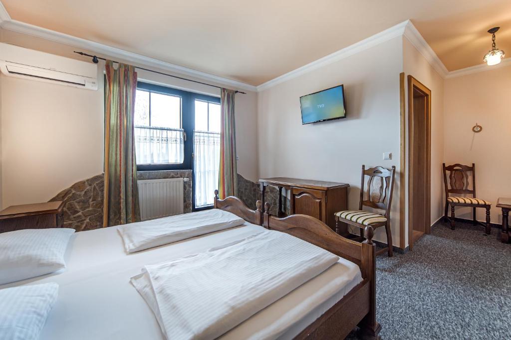 Postel nebo postele na pokoji v ubytování Garni Hotel Terano