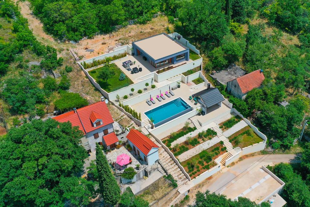 an overhead view of a house with a swimming pool at Luxury Resort Dobri Dida in Imotski