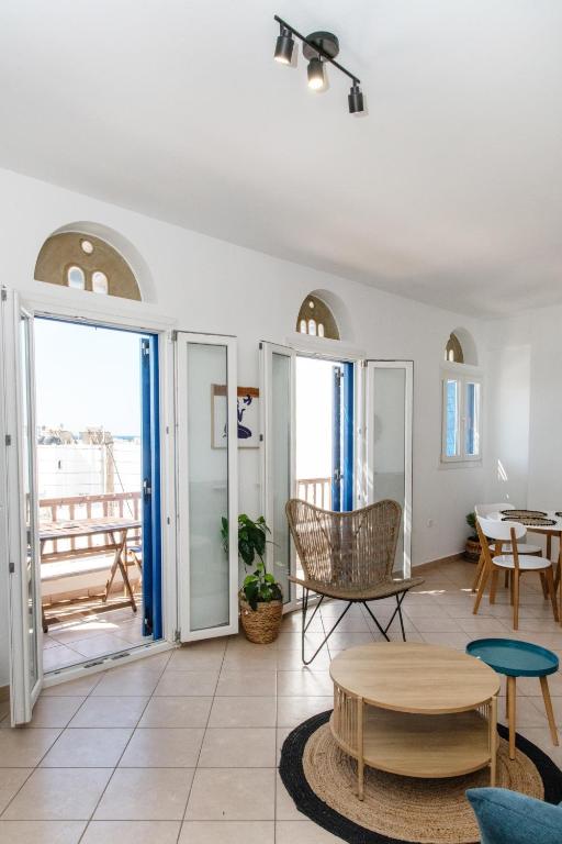 a living room with a view of the ocean at Casa Chora by Sea ALure in Tinos