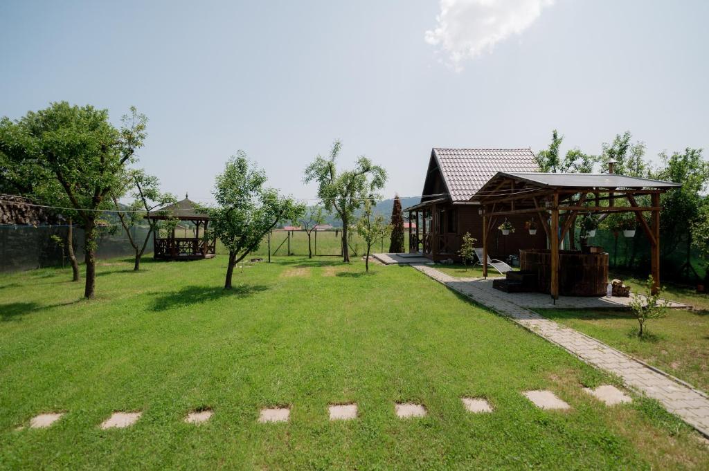 Zahrada ubytování Căsuțele de oaspeți Margó Vendégházikók