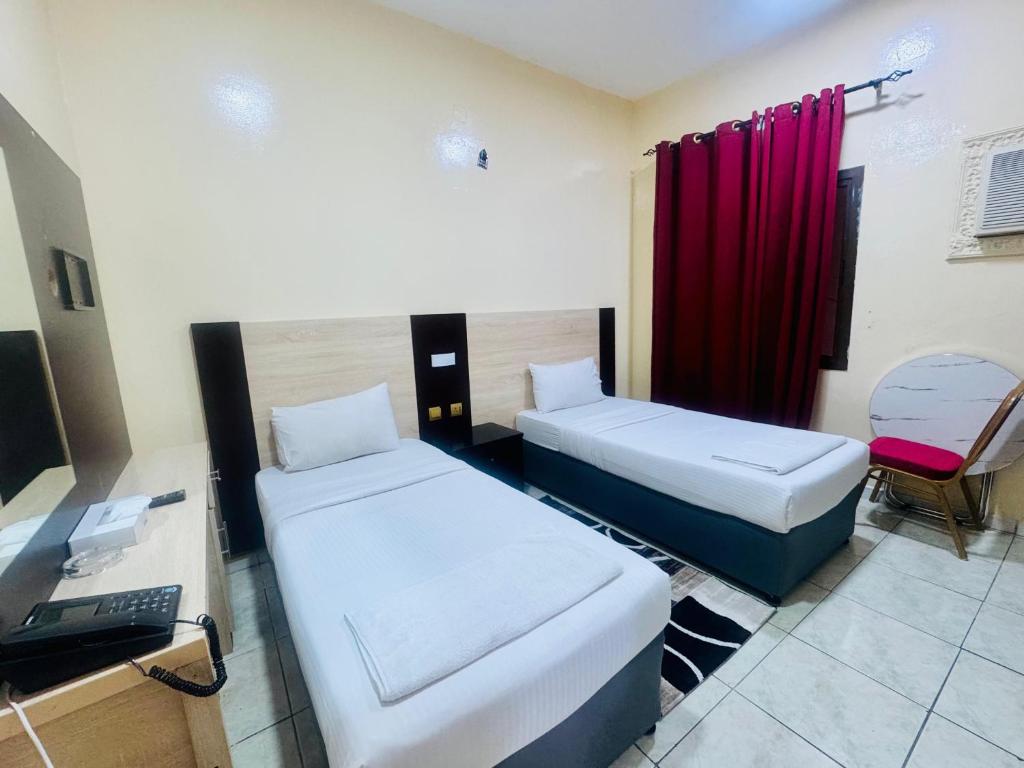 Postel nebo postele na pokoji v ubytování Al Ammari Hotel