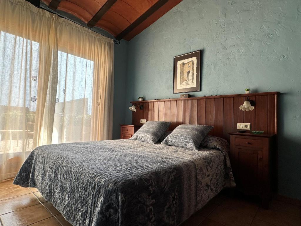 Postel nebo postele na pokoji v ubytování Turisme rural Can Genis