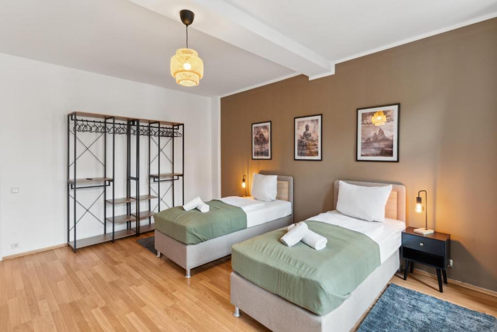 Ein Bett oder Betten in einem Zimmer der Unterkunft KERA STAY - Apartments Merseburg