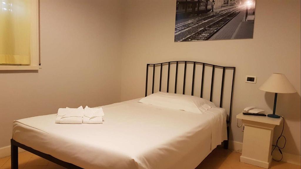 Postel nebo postele na pokoji v ubytování Grand Hotel Lamezia