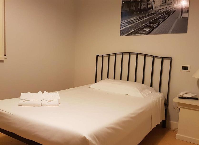 Postel nebo postele na pokoji v ubytování Grand Hotel Lamezia
