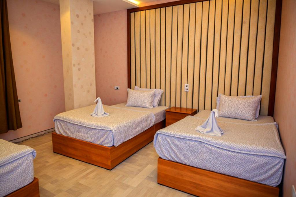 Postel nebo postele na pokoji v ubytování Pyramids Grand View Hotel