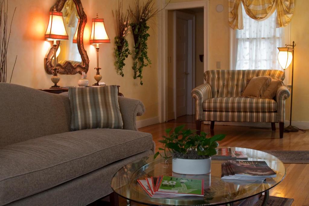 a living room with a couch and a coffee table at Scranton Seahorse Inn in Madison