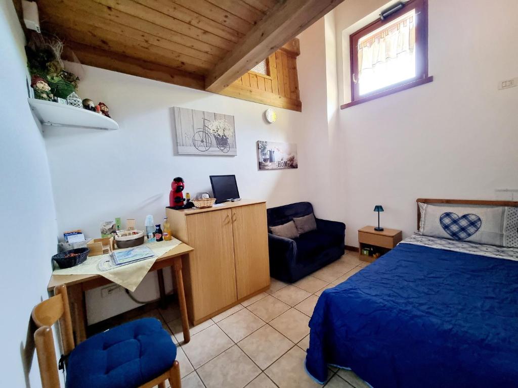 Postel nebo postele na pokoji v ubytování Camera Adamello 1