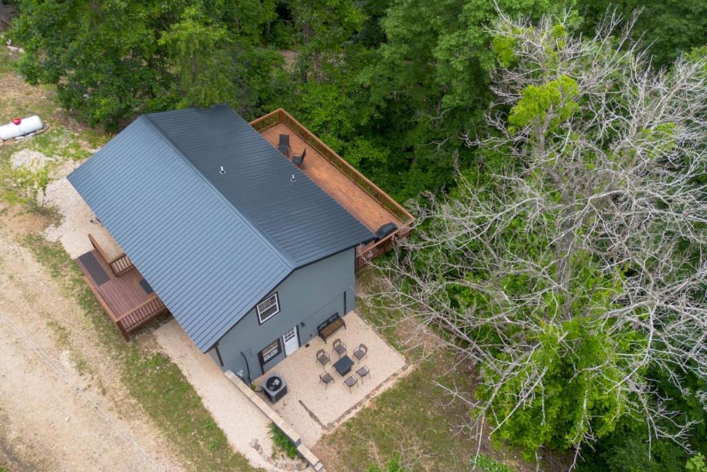 an overhead view of a house with a blue roof at Peace in the Holler in Eureka Springs
