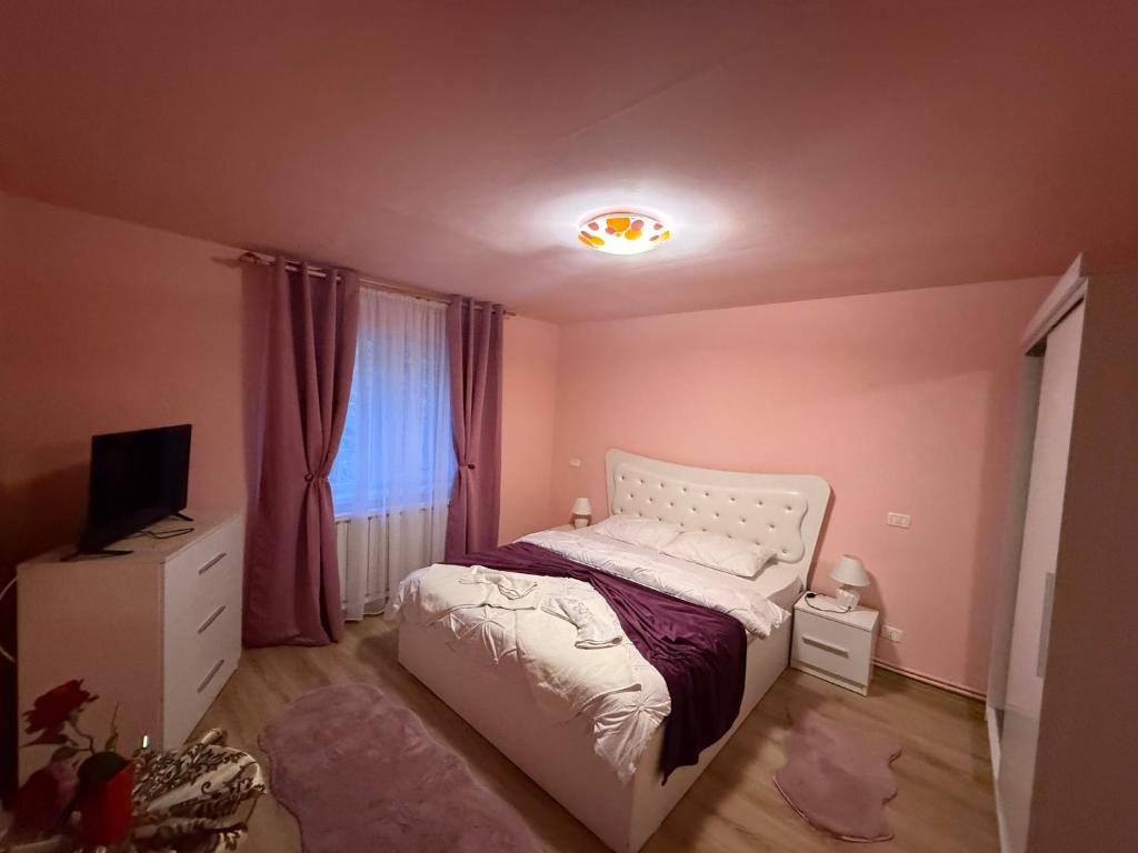 Ένα ή περισσότερα κρεβάτια σε δωμάτιο στο Casa Stefania