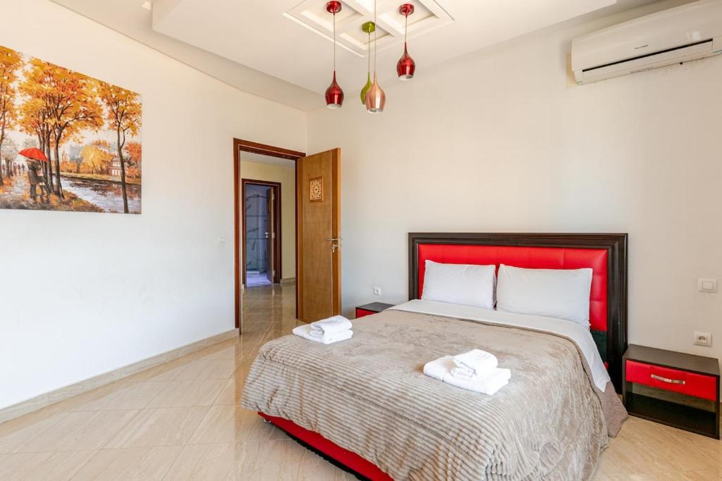 Postel nebo postele na pokoji v ubytování Bel appartement front mer Tanger