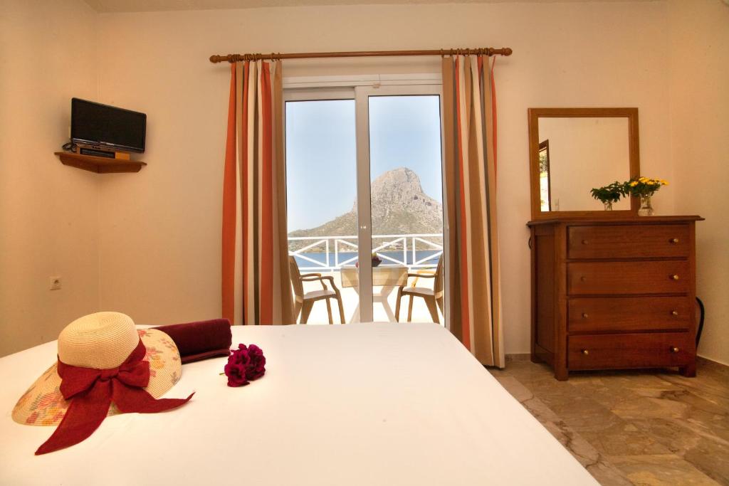 מיטה או מיטות בחדר ב-Acropolis Hotel