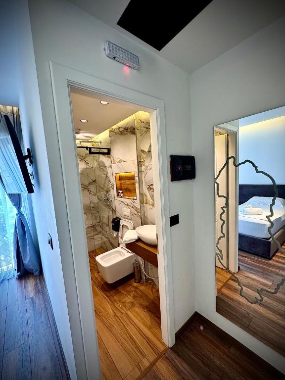 Postel nebo postele na pokoji v ubytování Martin Luxury Hotel