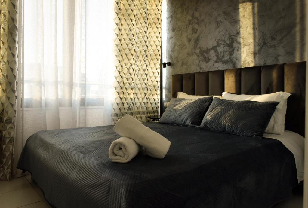 Postel nebo postele na pokoji v ubytování Hotel Riviera