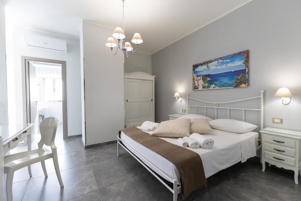 Postel nebo postele na pokoji v ubytování Bed and Breakfast Arcobaleno