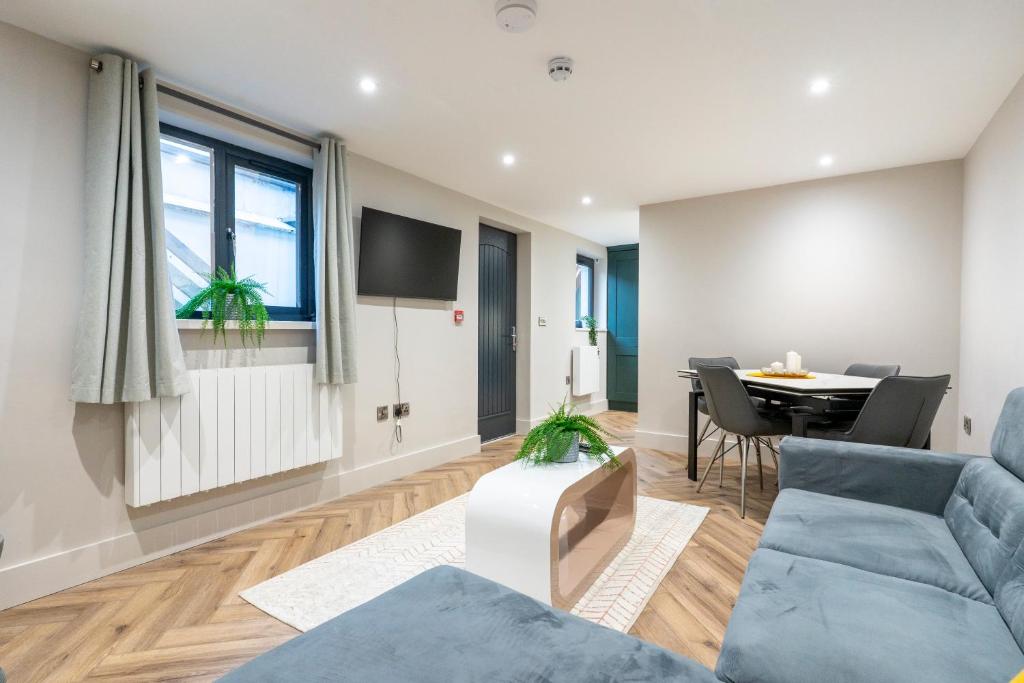a living room with a couch and a table at Princess Street luxury apt - Portrush in Portrush