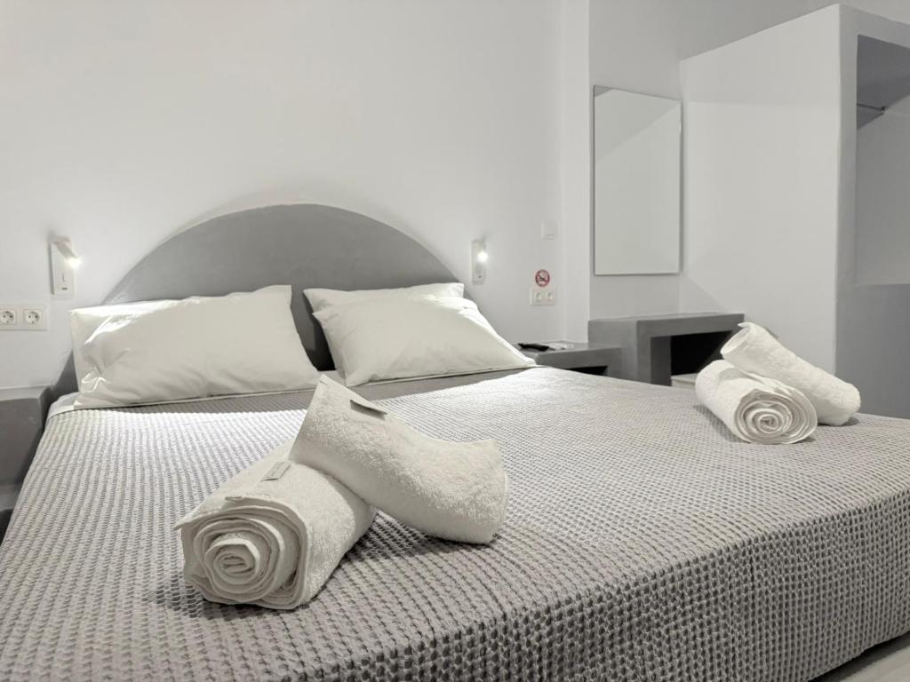 Postel nebo postele na pokoji v ubytování Urban Tinos