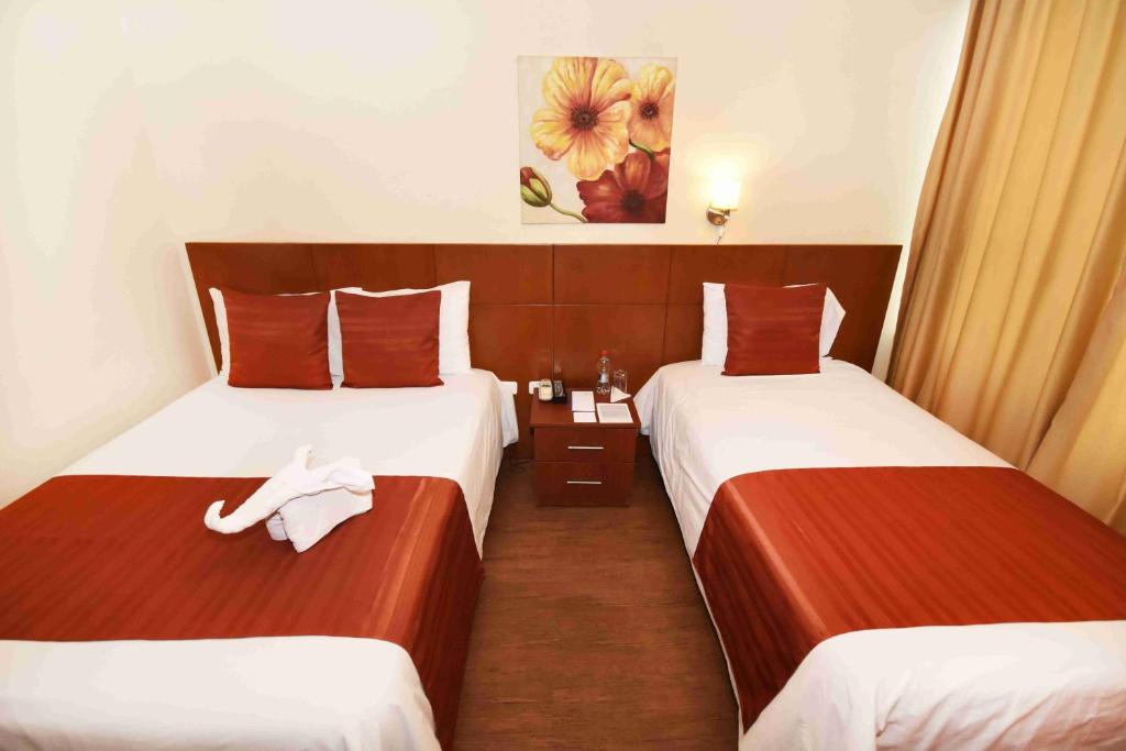 Postel nebo postele na pokoji v ubytování Hotel Montecarlo