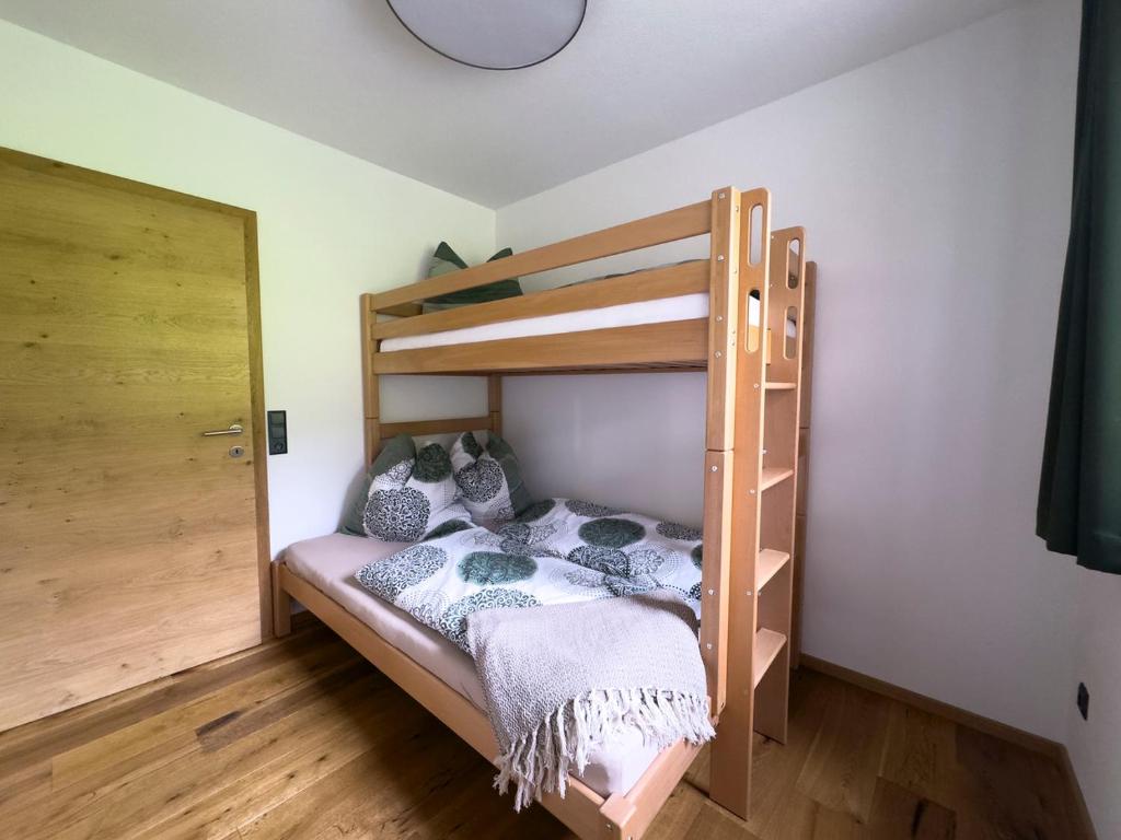 Postel nebo postele na pokoji v ubytování Rennerhof - Ferienwohnung im Lesachtal