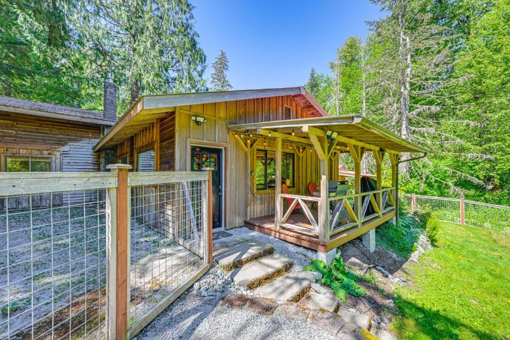 a wooden house with a gazebo in the yard at 5 Mi to Mt Rainier Natl Park Cozy Cabin with Deck! in Ashford