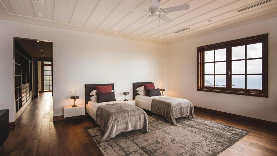 Postel nebo postele na pokoji v ubytování Pearl Horizon Villa