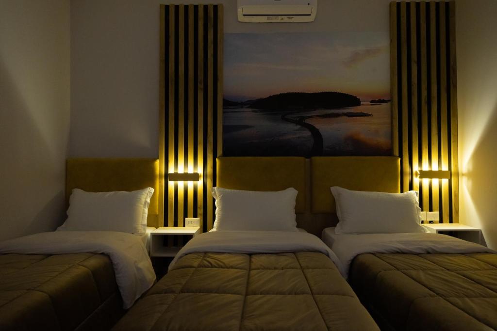 Postel nebo postele na pokoji v ubytování Hotel Beler