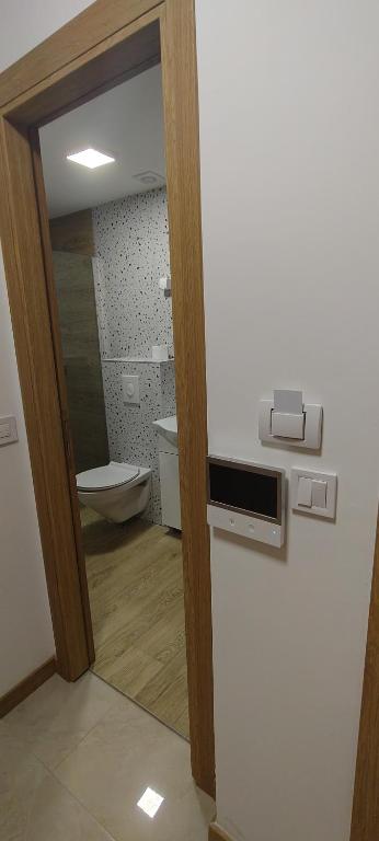 Koupelna v ubytování Pini Apart-hotel