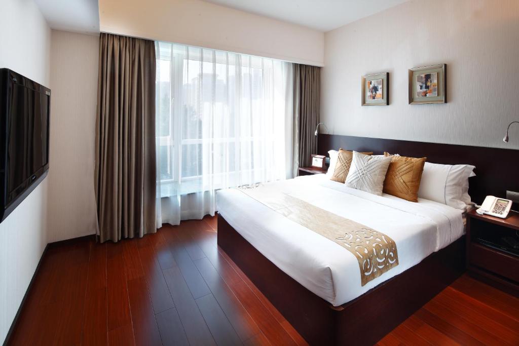 Postel nebo postele na pokoji v ubytování 广州友和酒店Yuwa Hotel-Free Shuttle Bus to Canton Fair Complex DuringCanton Fair Period