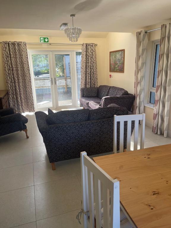 a living room with a couch and a table at Void B in Ballybofey