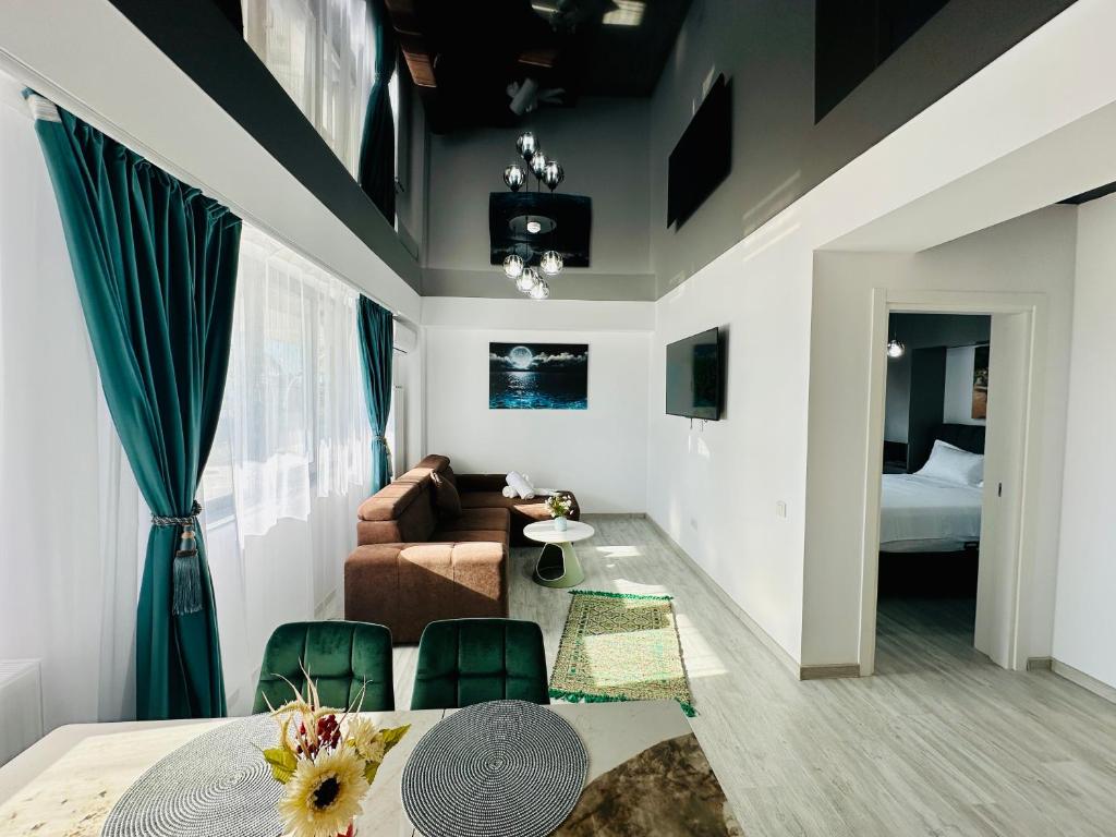 a living room with a couch and a table at MiMar Apartment in Năvodari