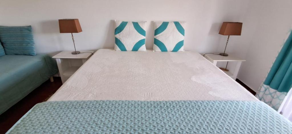 Cama ou camas em um quarto em Apartamento Neptuno