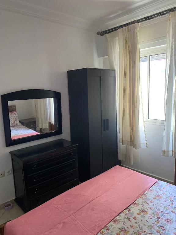 Postel nebo postele na pokoji v ubytování Grand Appartement Martil