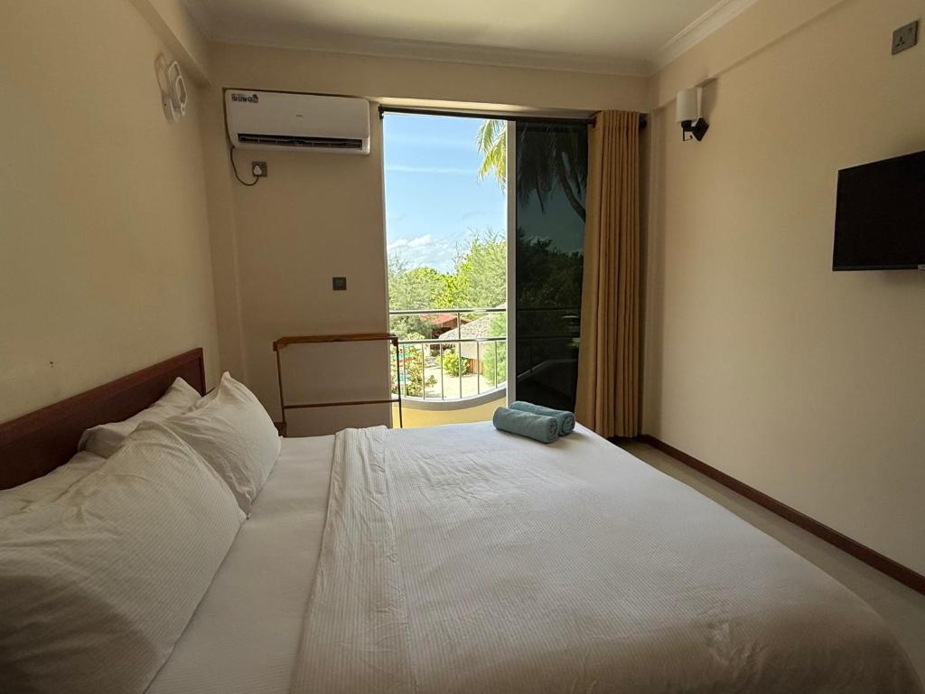 Postel nebo postele na pokoji v ubytování Noah Private Beach House