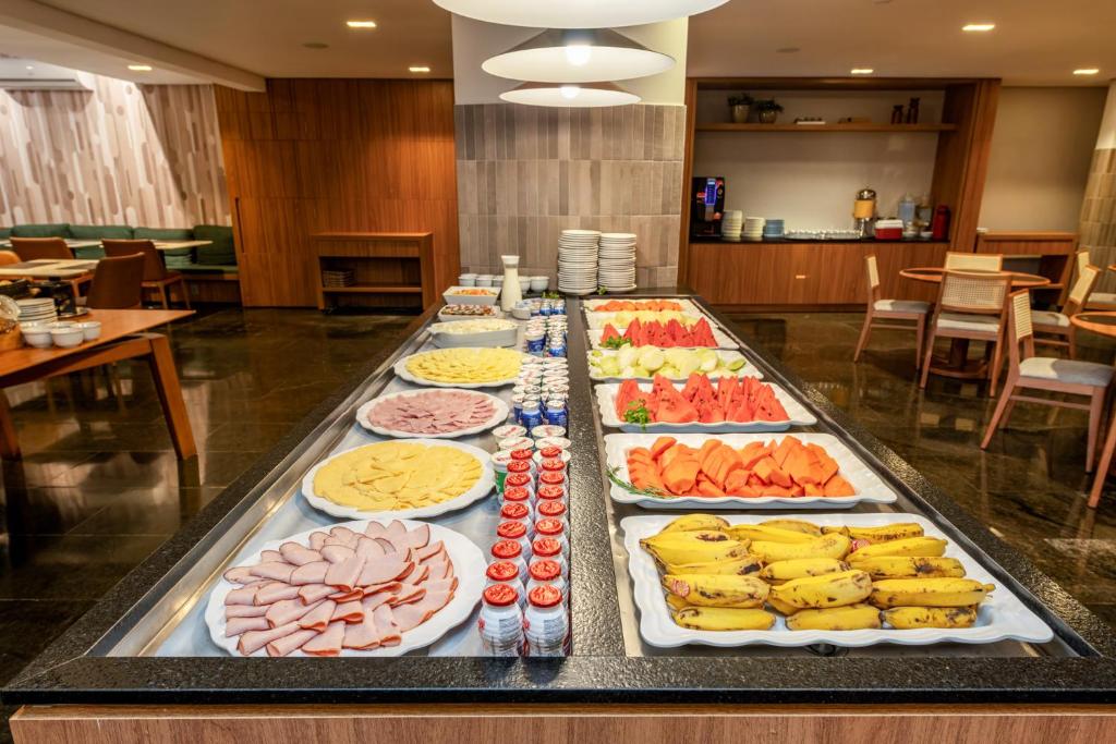 a buffet line with many different types of food at Hotel Trianon Paulista in Sao Paulo