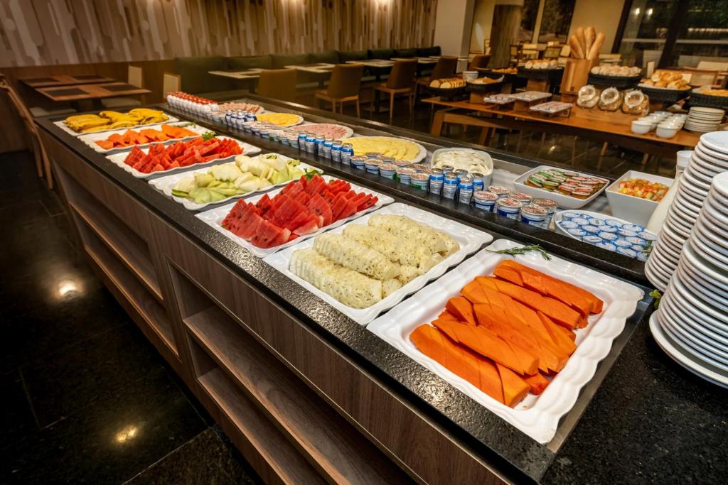 a buffet line with many different types of food at Hotel Trianon Paulista in Sao Paulo