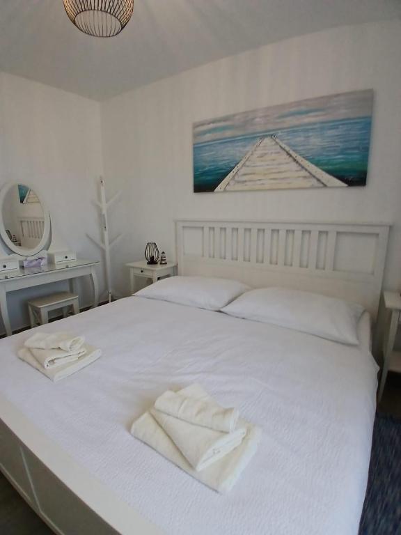 Posteľ alebo postele v izbe v ubytovaní Apartment ANTONELLA