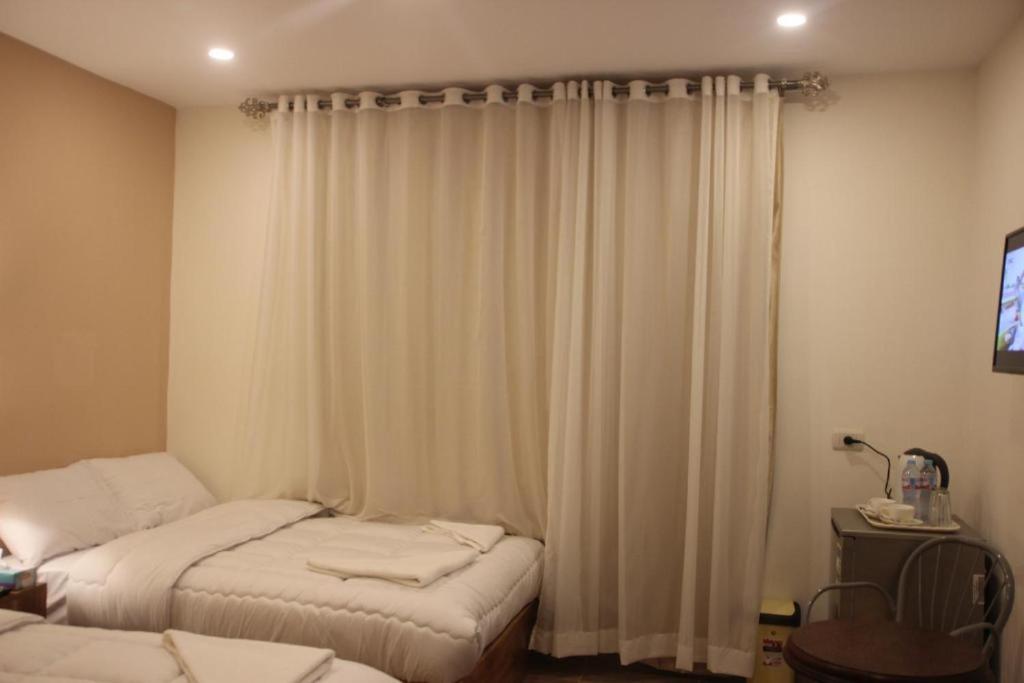 Postel nebo postele na pokoji v ubytování Mystic - Pyramids Inn